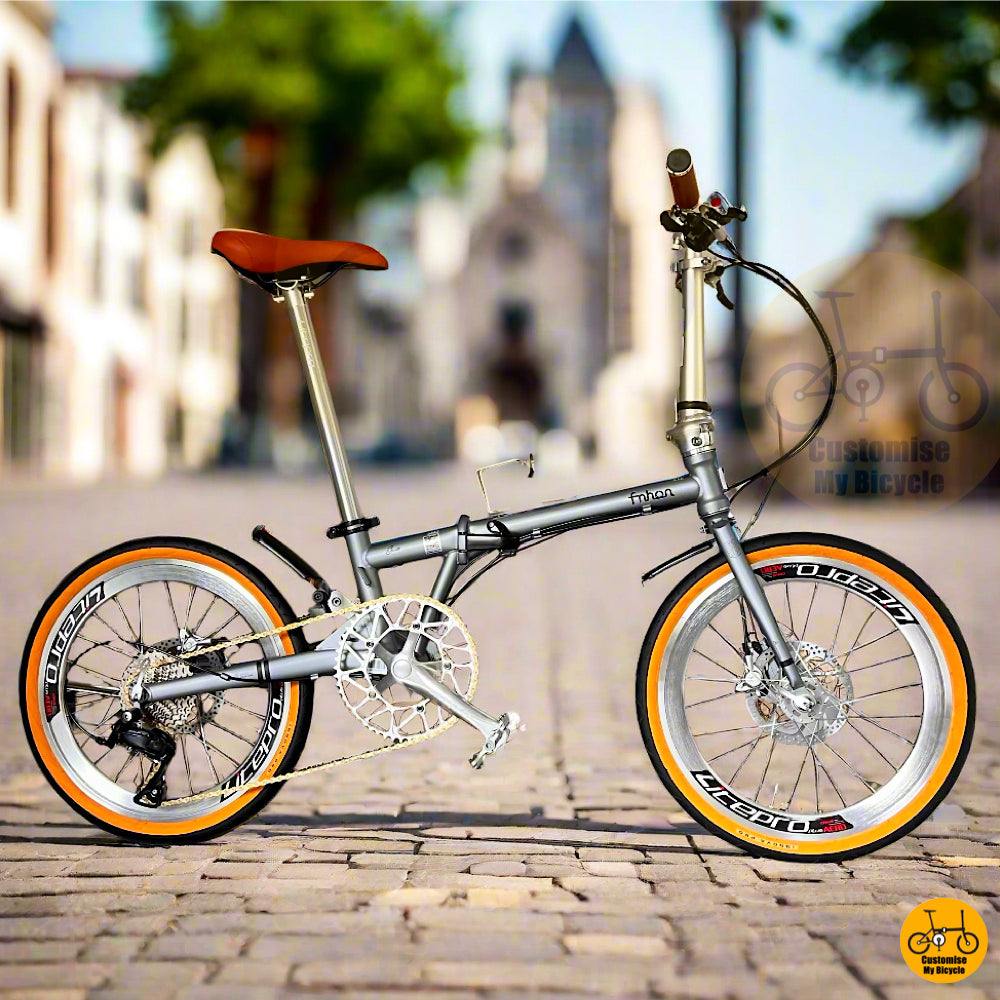 Fnhon Gust folding bike in battleship grey with tan wall tyres  
