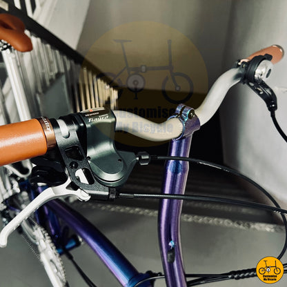 Glossy blue frame folding bike with ergonomic saddle and handlebars
