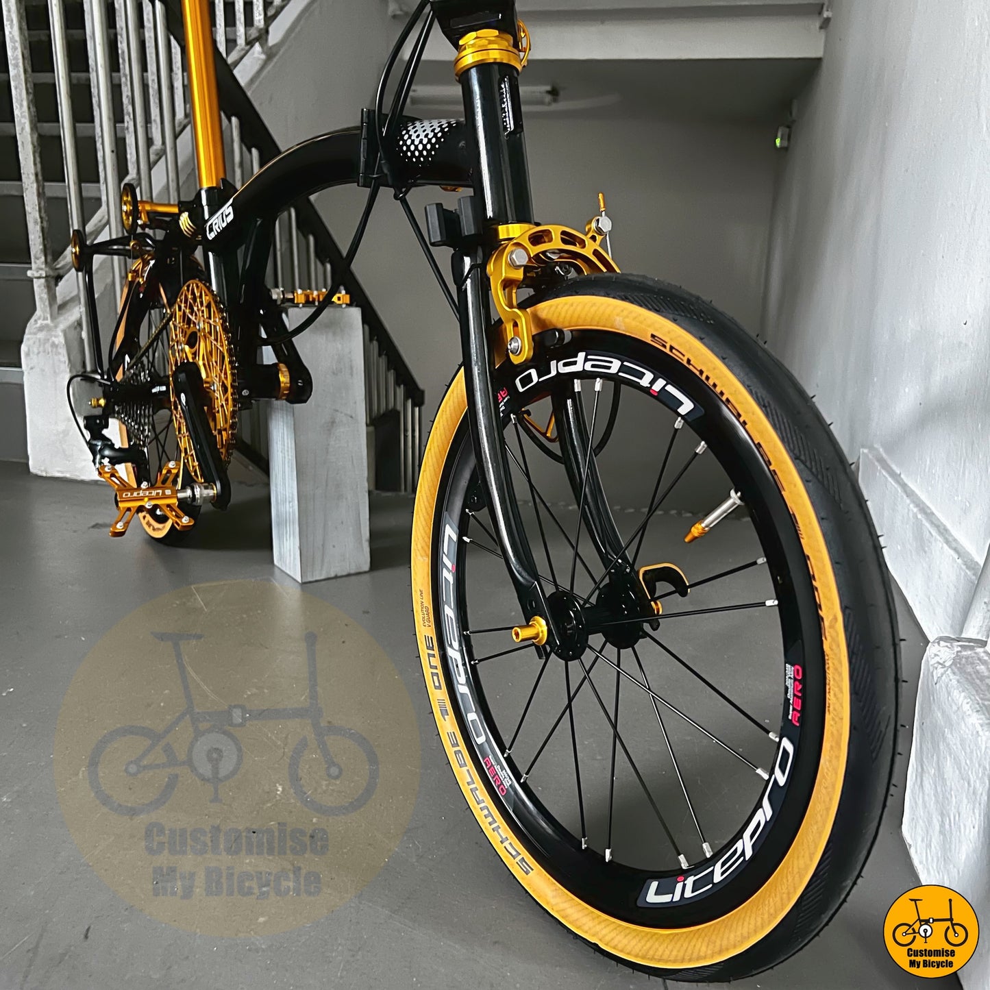 Crius Trifold 18-inch folding bike with black and gold frame
