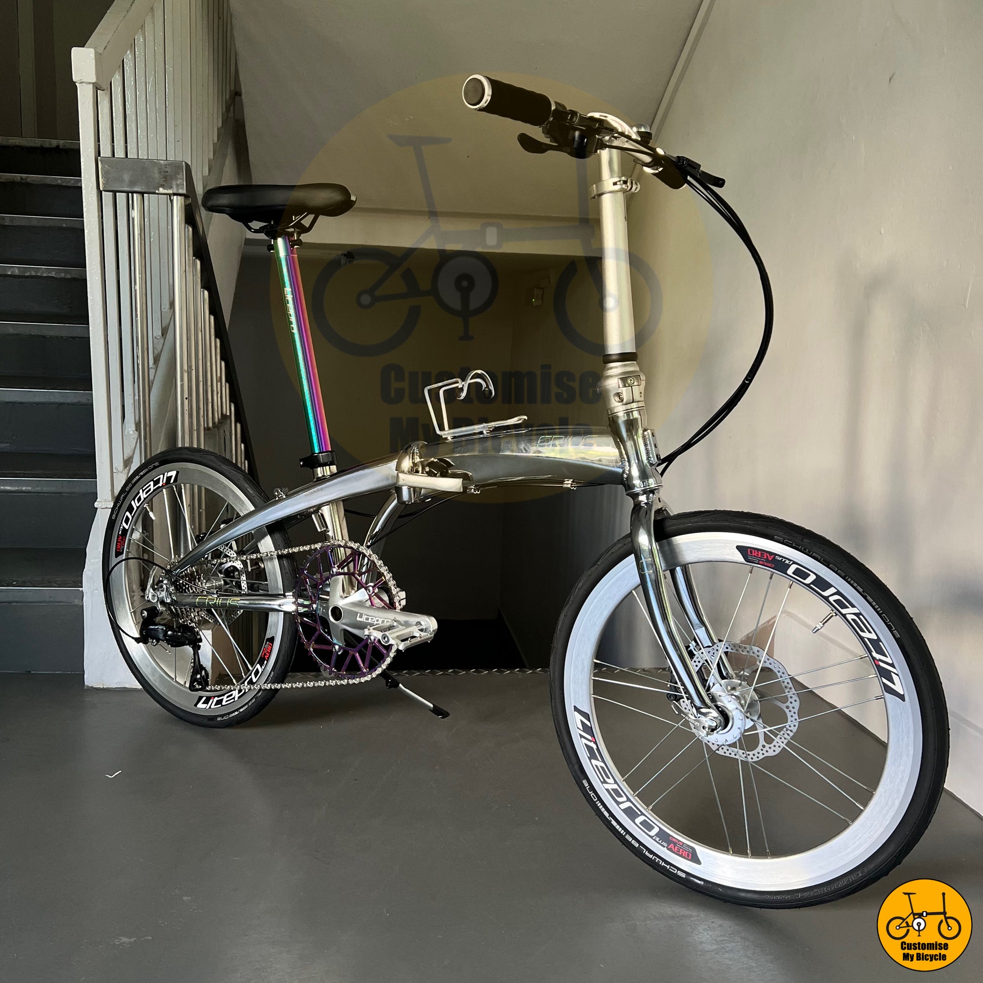 Crius Velocity 22-inch Folding Bike – Chrome Silver Frame with Oil Slick Accents
