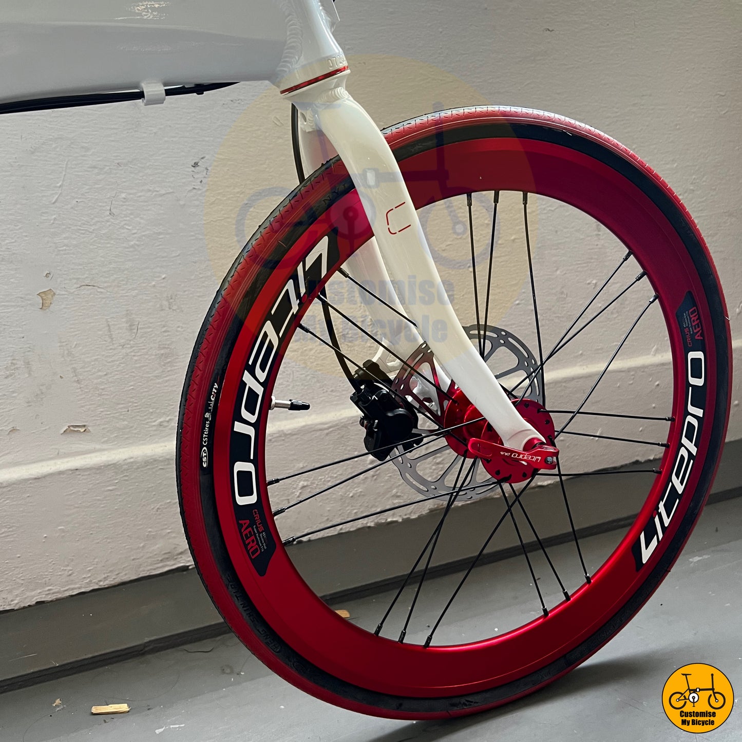Close-up of the bold red Litepro wheels for a striking contrast
