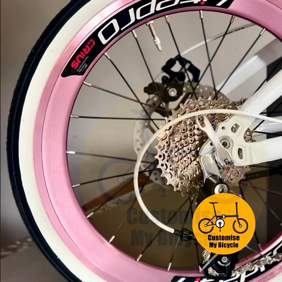 Compact 20 Inch Folding Bike In White Pink For Comfortable Rides With Lightweight Alloy Frame  
