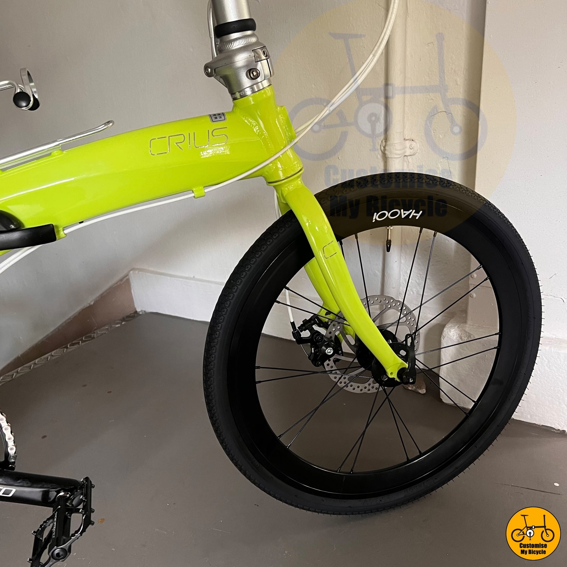 Compact and lightweight foldable bicycle with a vibrant lime green frame
