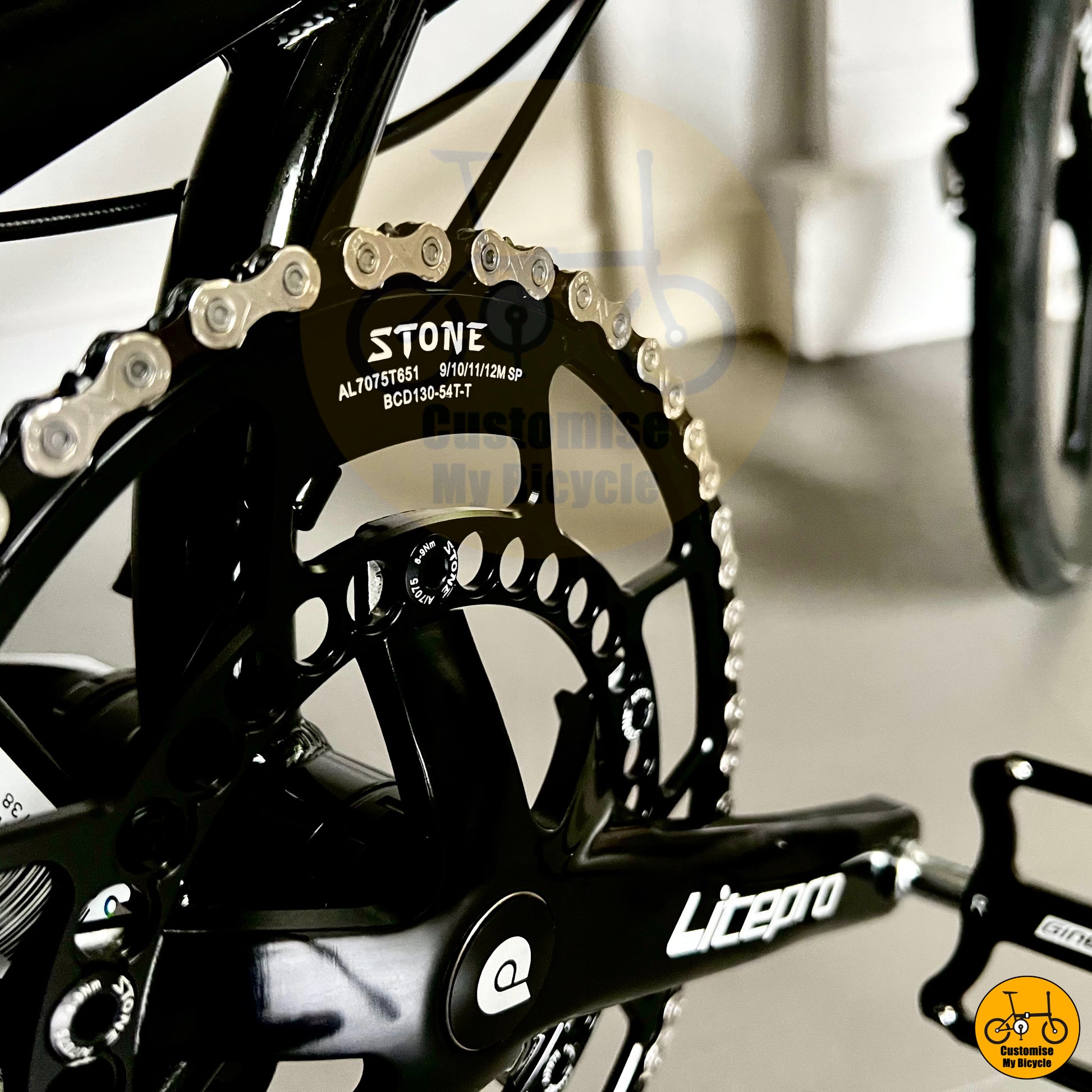 Stone chainring on Premium Fnhon Blast 20” Black Gold City Folding Bike – Performance Meets Style
