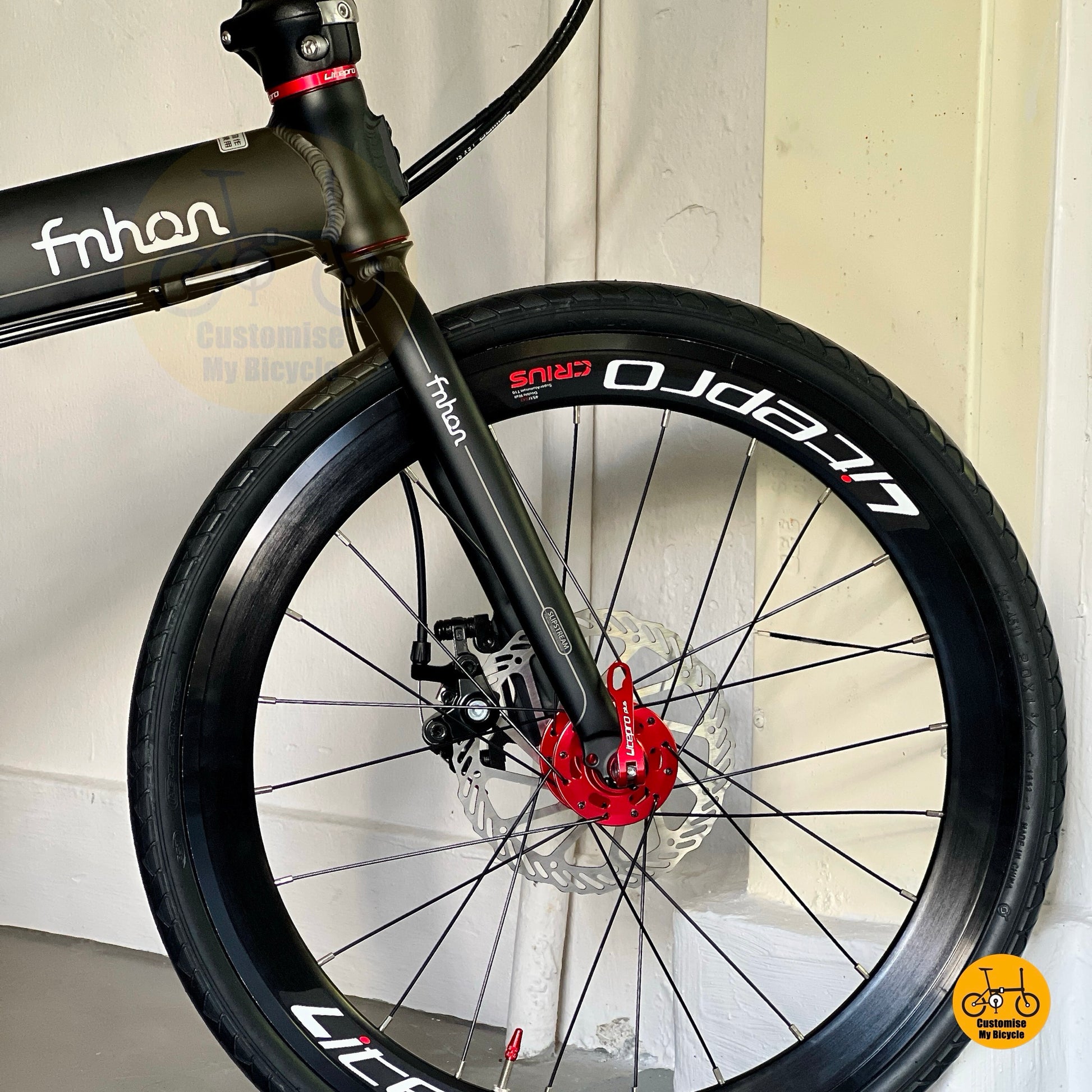 Close up of Litepro Aero front wheel on 22 inch folding bicycle