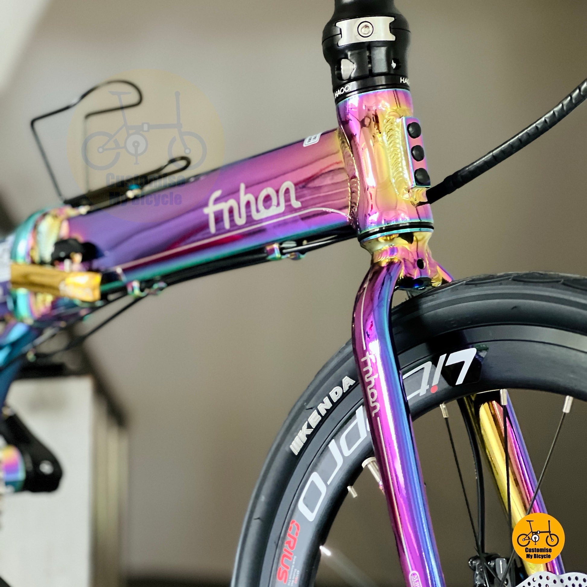 Oil Slick Aurora folding bicycle parked display showcasing lightweight aluminium alloy frame