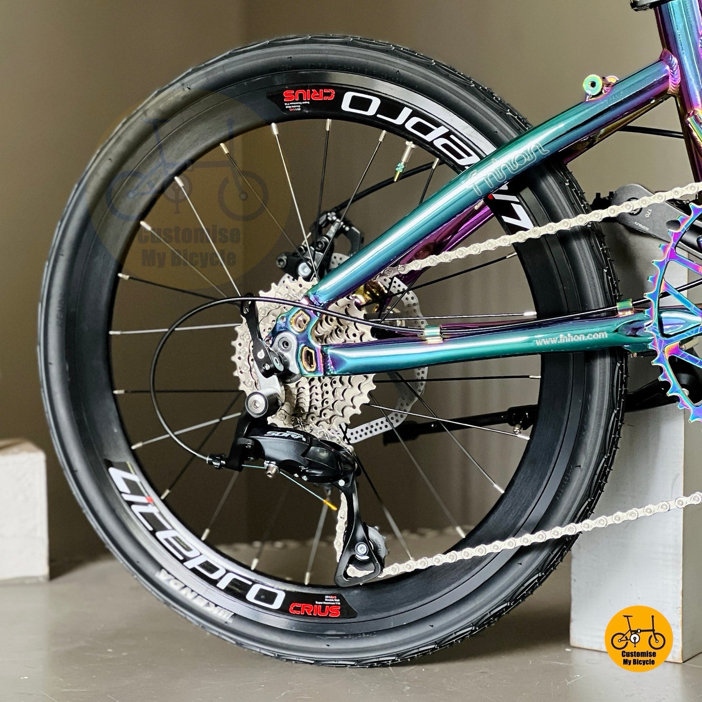 Shimano 9 gears close up on Fnhon Blast folding bike drivetrain and rear derailleur system