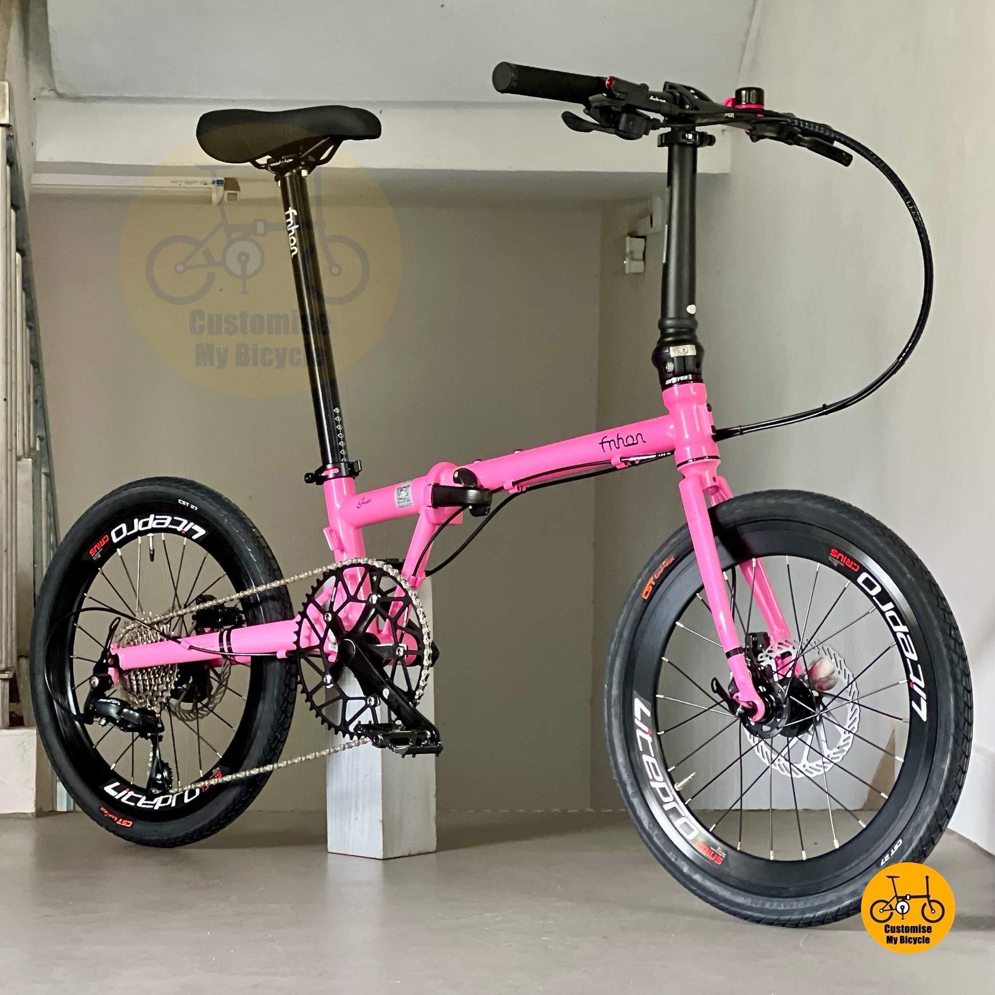 Lower front angle of Fnhon Gust 20 inch hot pink folding bicycle with CST tyres
