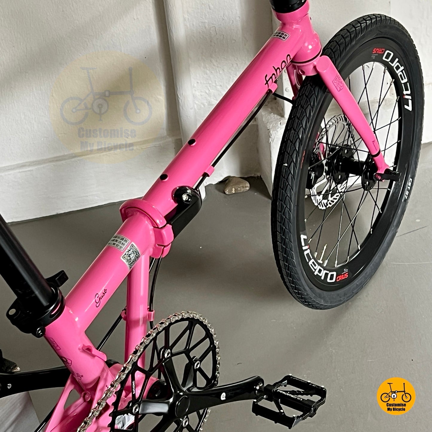 Detail shot of Fnhon Gust hot pink folding bicycle showing customised comfy saddle and adjustable seatpost