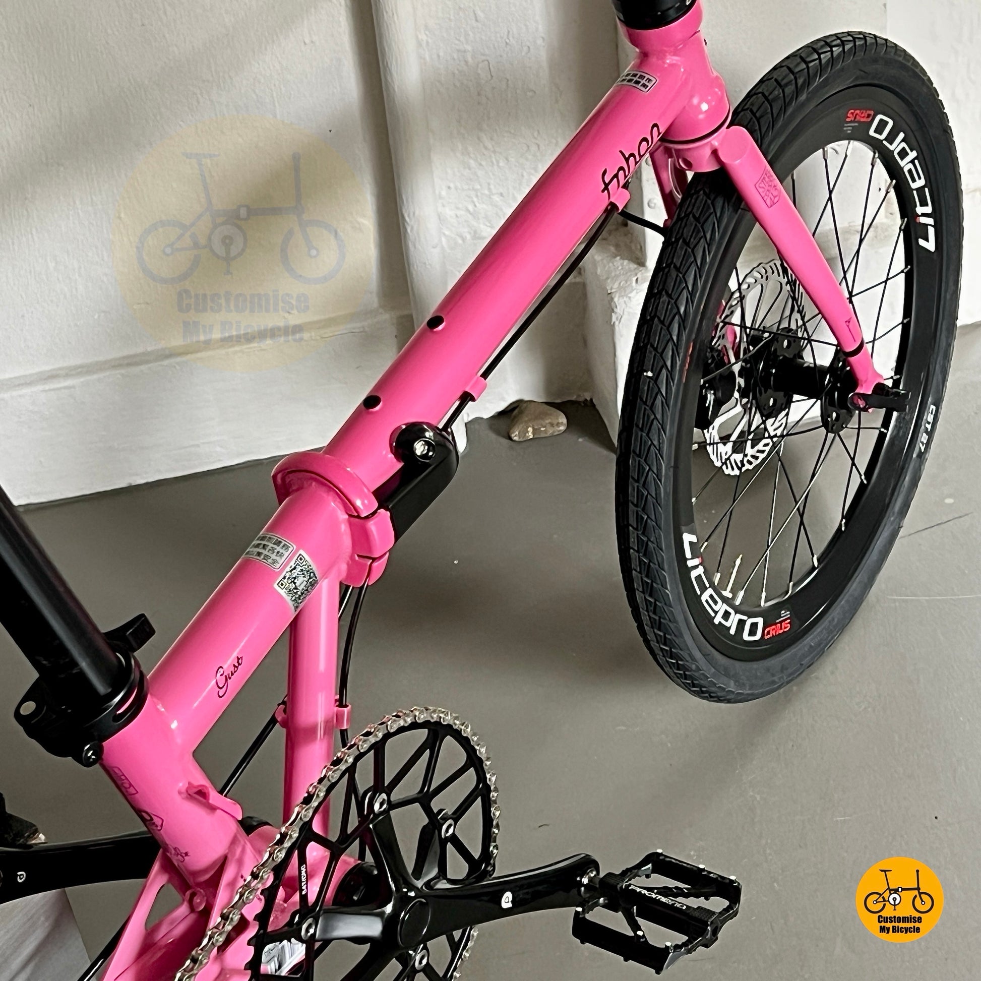 Detail shot of Fnhon Gust hot pink folding bicycle showing customised comfy saddle and adjustable seatpost