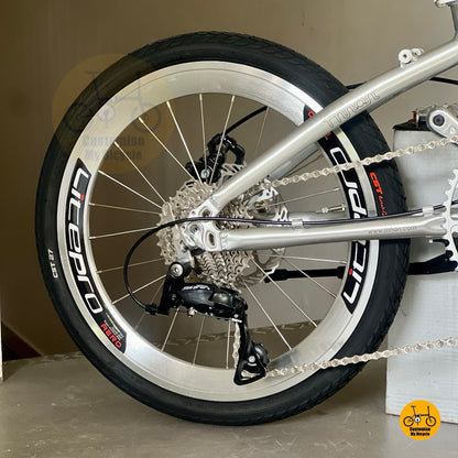 Shimano 9 gears drivetrain close up folding bike cassette and derailleur detail
