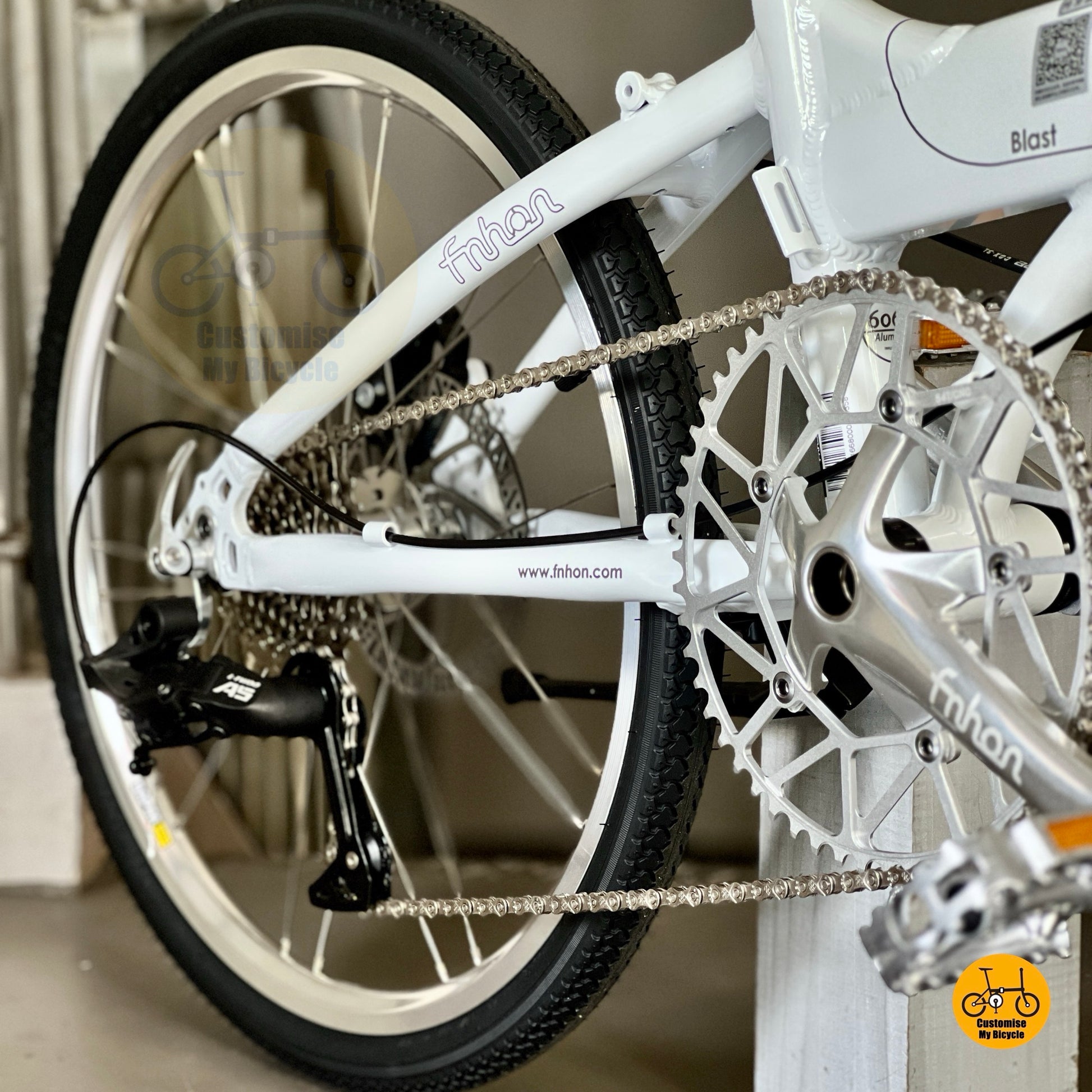 Rear derailleur view of white foldable bike with LTwoo 9s
