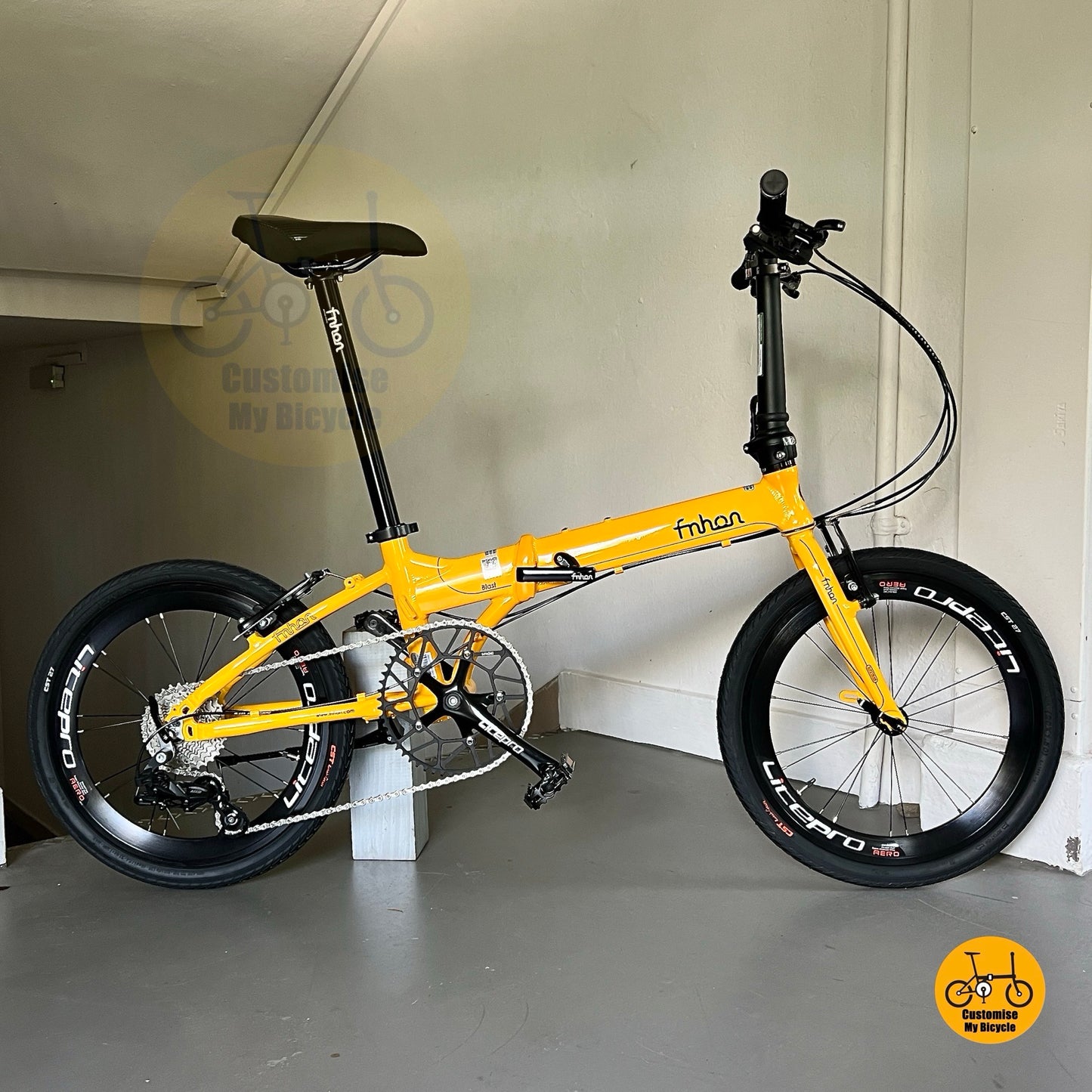 Golden yellow Fnhon Blast foldable bicycle with aero high profile wheels and CST city tyres  

