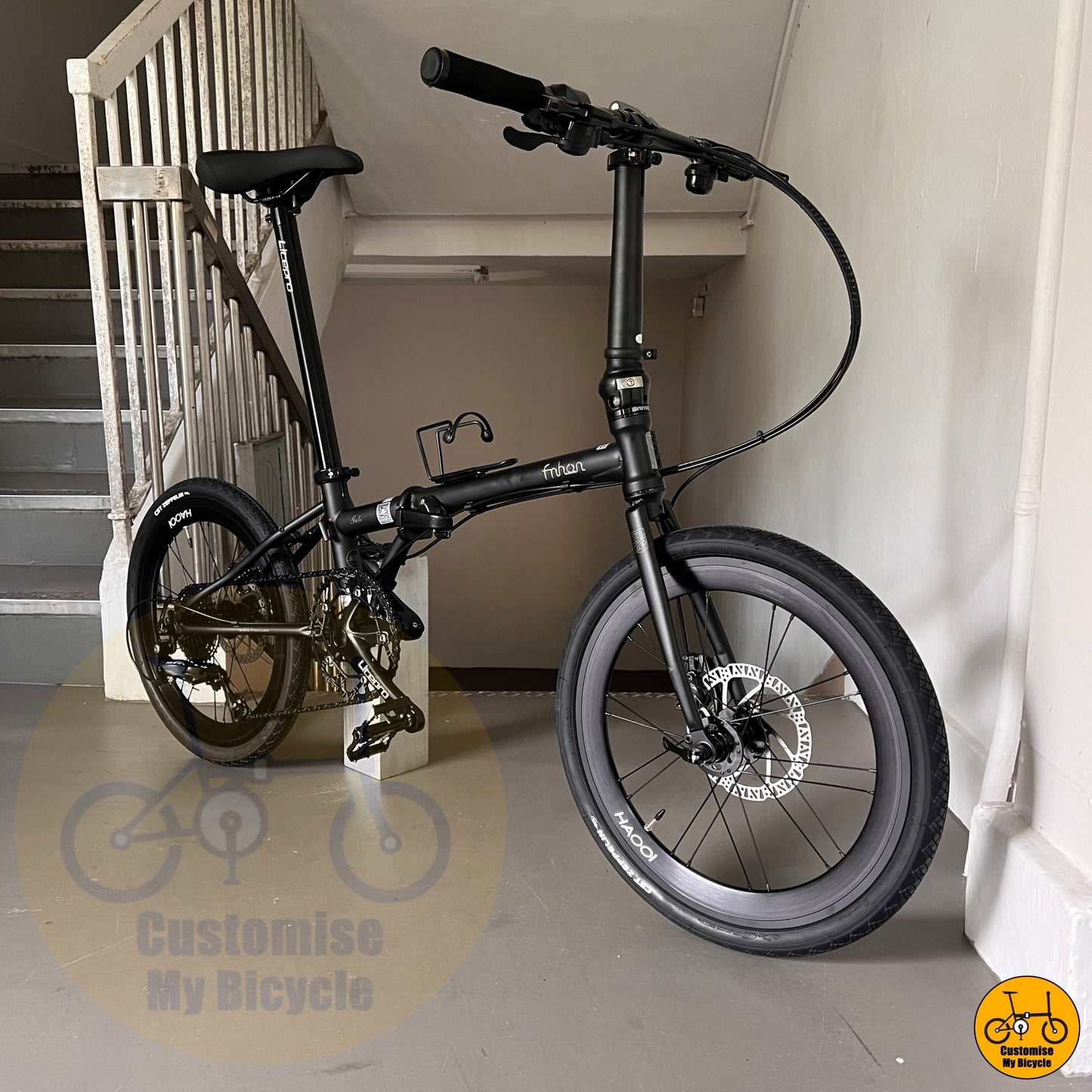 Matte black foldie bicycle with reinforced Gust-style frame
