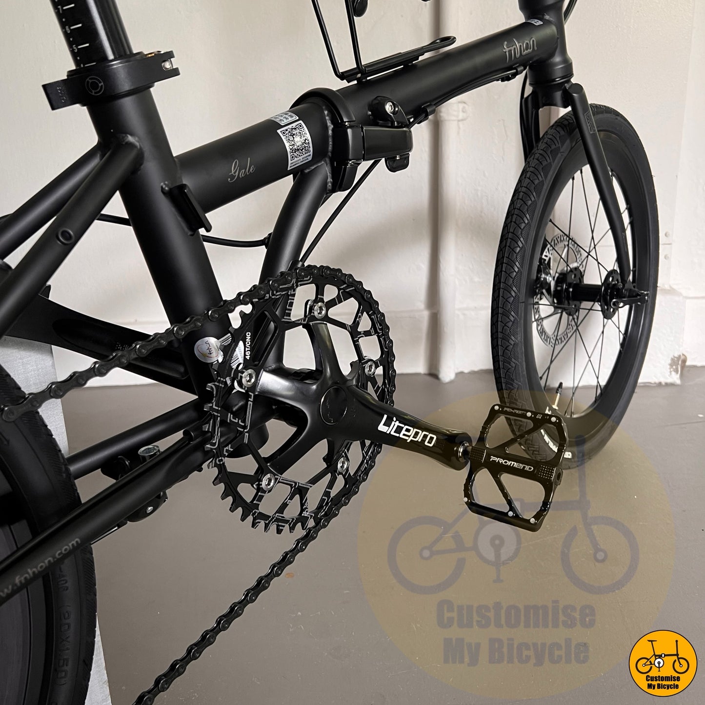 Dark-themed bicycle with high contrast branding