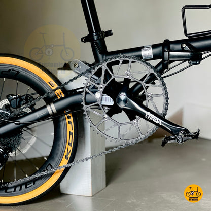 Folding bicycle stylish matte black frame tan wall tyres urban city bike
