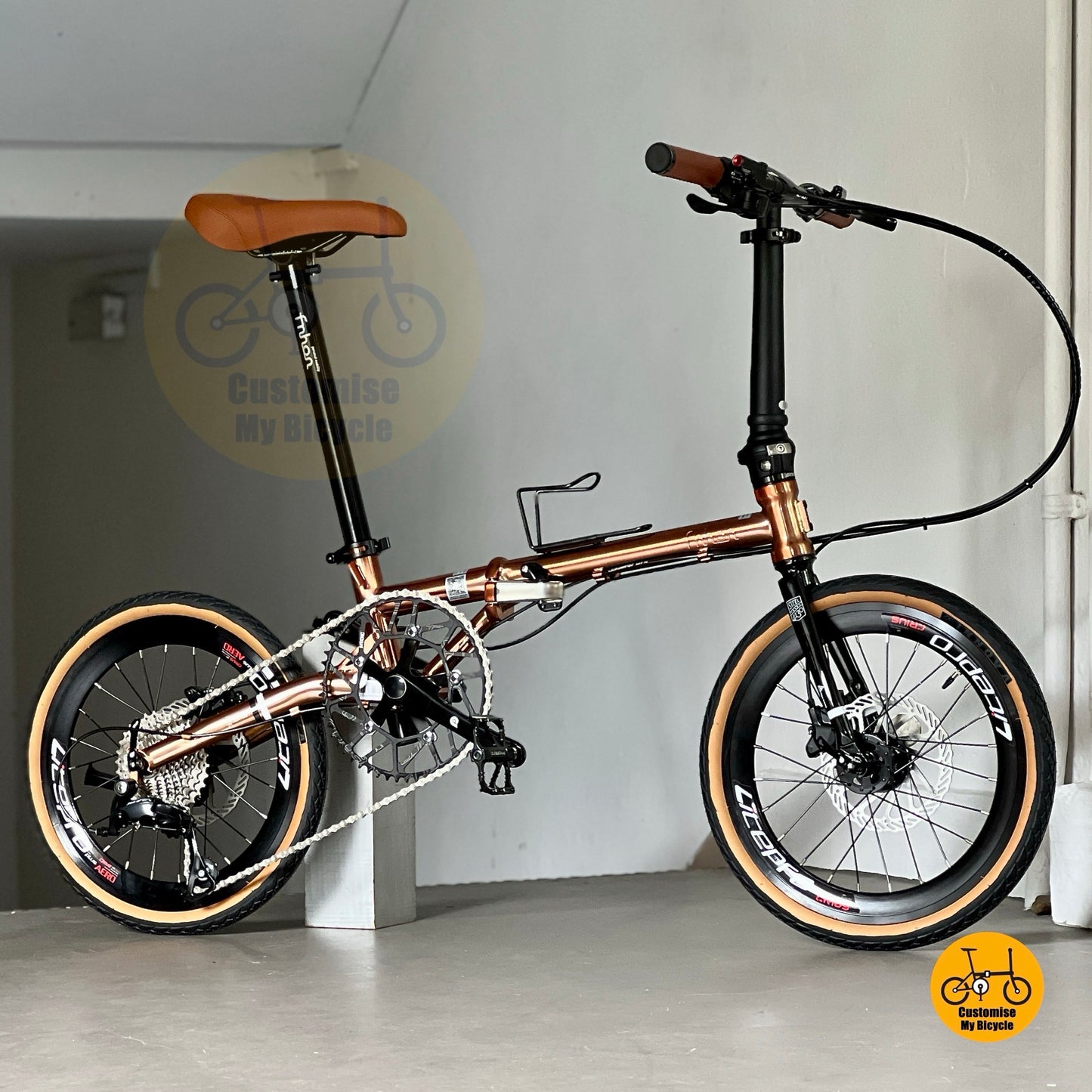 Side view of Fnhon Gust 18 inch Rose Gold folding bike with strong chromoly steel body frame and brown tyres