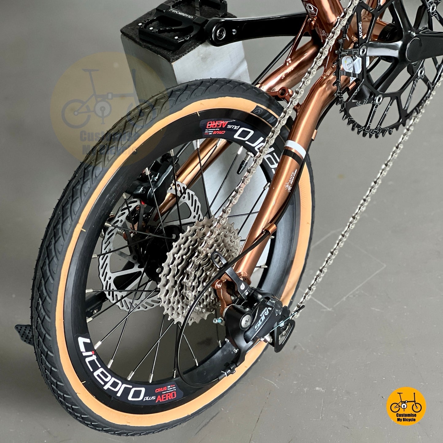 Rear derailleur view showing SHIMANO 9 gears Sora drivetrain on Fnhon Gust 18 inch Rose Gold folding bike