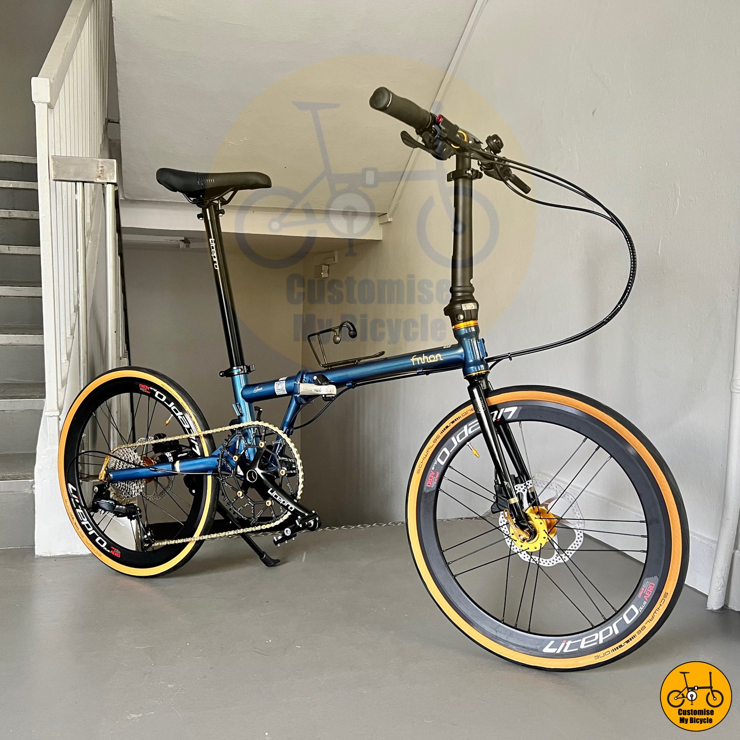 Deep sea blue Fnhon Gust 22-inch folding bike with Schwalbe One tan wall tyres
