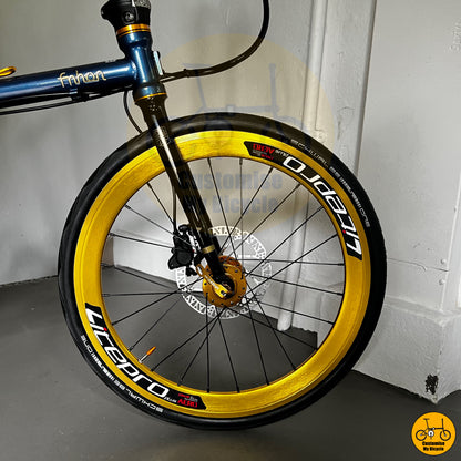 Deep blue folding bike with high-performance disc brakes
