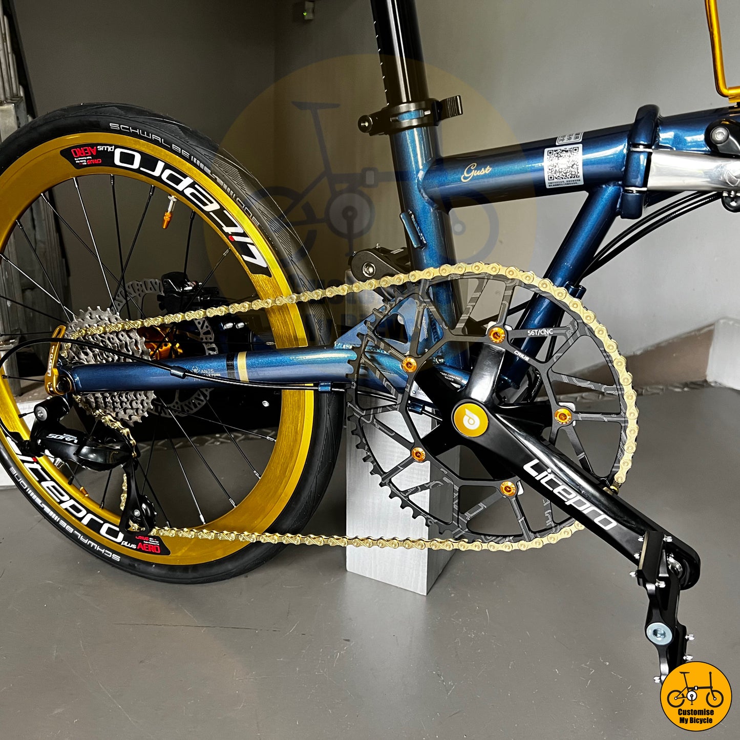 Folding bicycle with gold-accented rims and premium components
