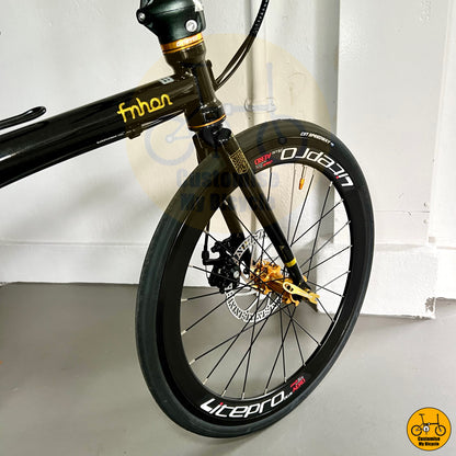 City-ready foldable bicycle with aerodynamic black wheels
