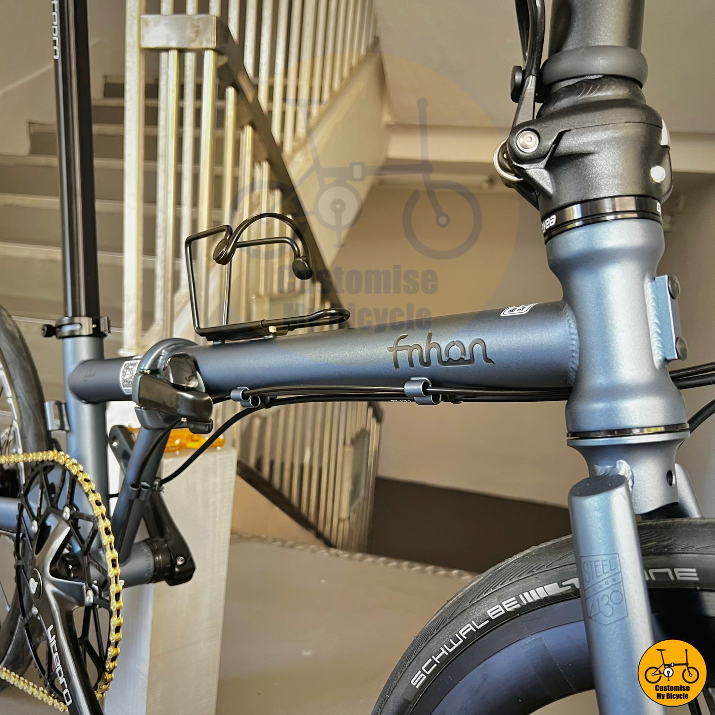 Sleek battleship grey foldie featuring gold pedals for a premium finish
