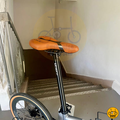 Stylish battleship grey folding bike with comfortable brown saddle
