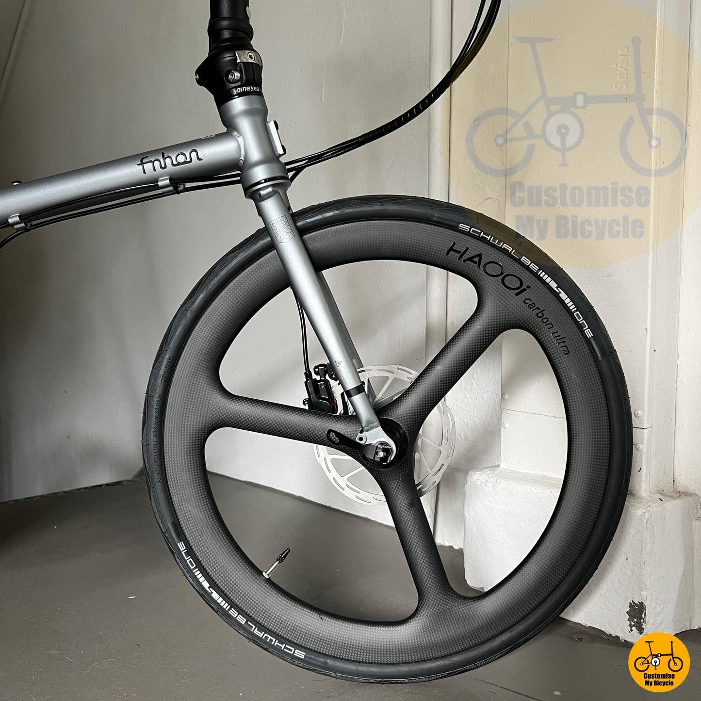 Haooi trispoke carbon wheels on sleek 22-inch folding bike
