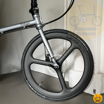 Haooi trispoke carbon wheels on sleek 22-inch folding bike
