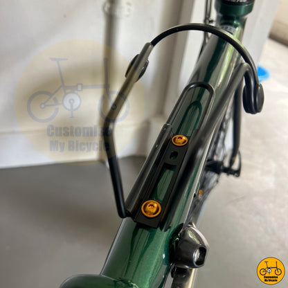 Postal green folding bike with classic round bar design  
