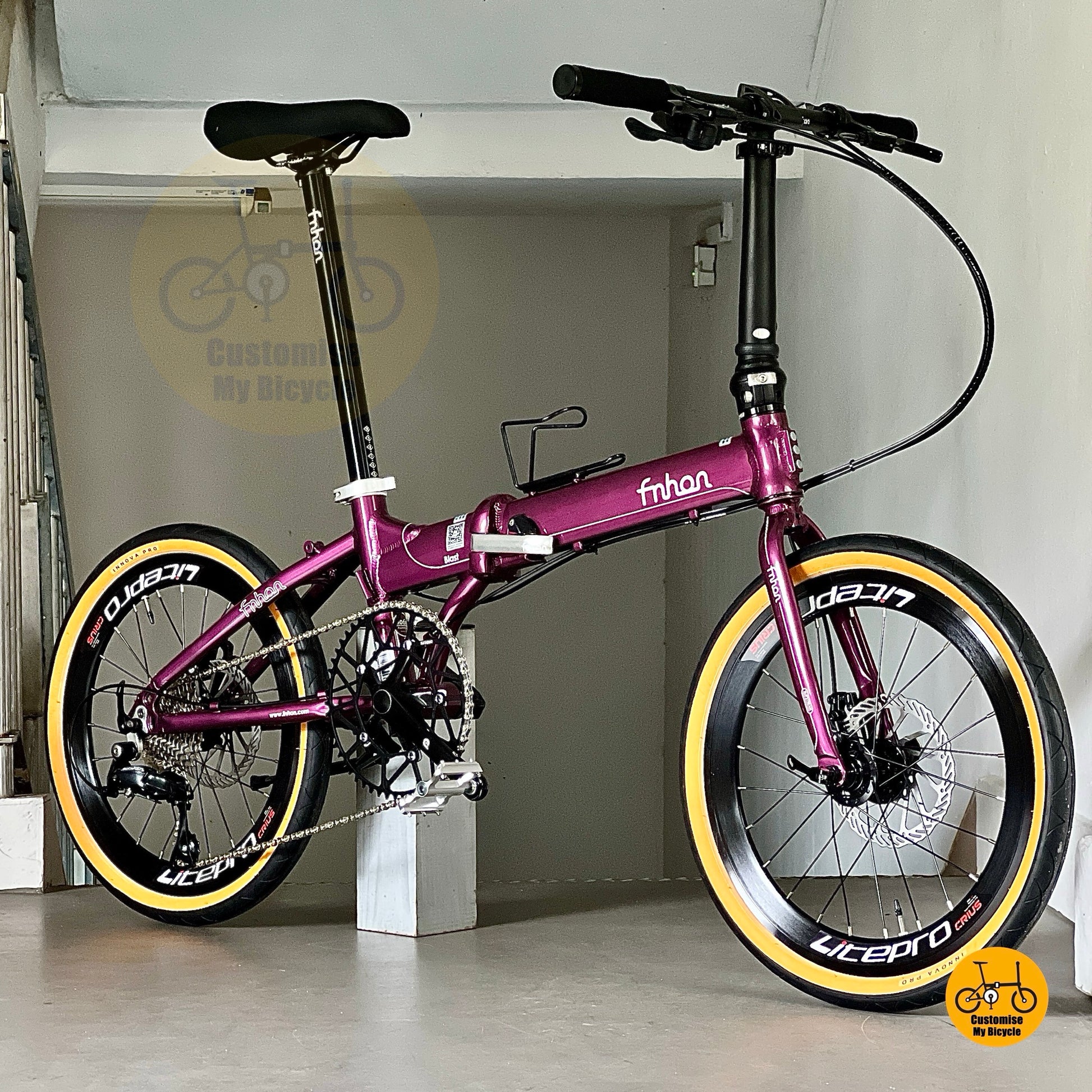 Lower front angle of Fnhon Blast 20 inch Royale Purple folding bicycle with INNOVA tyres
