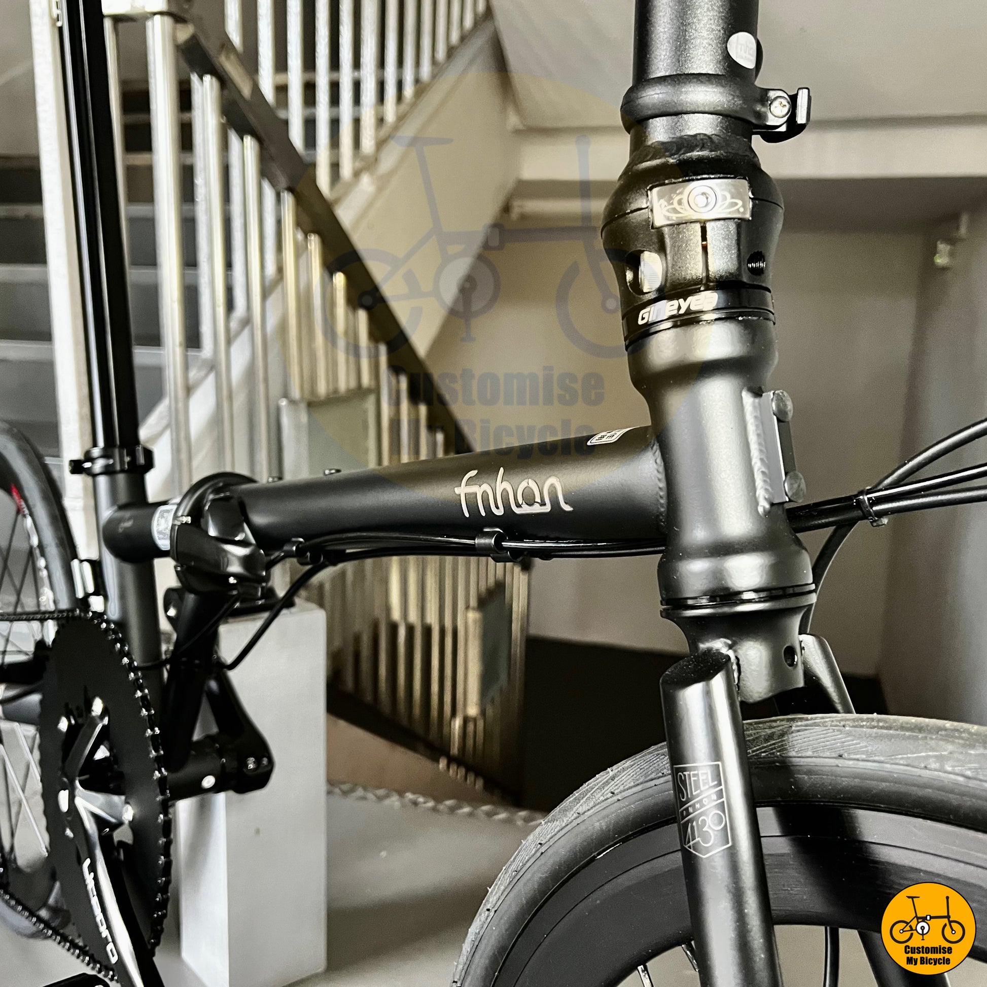 Stealthy black folding bike with performance-grade components
