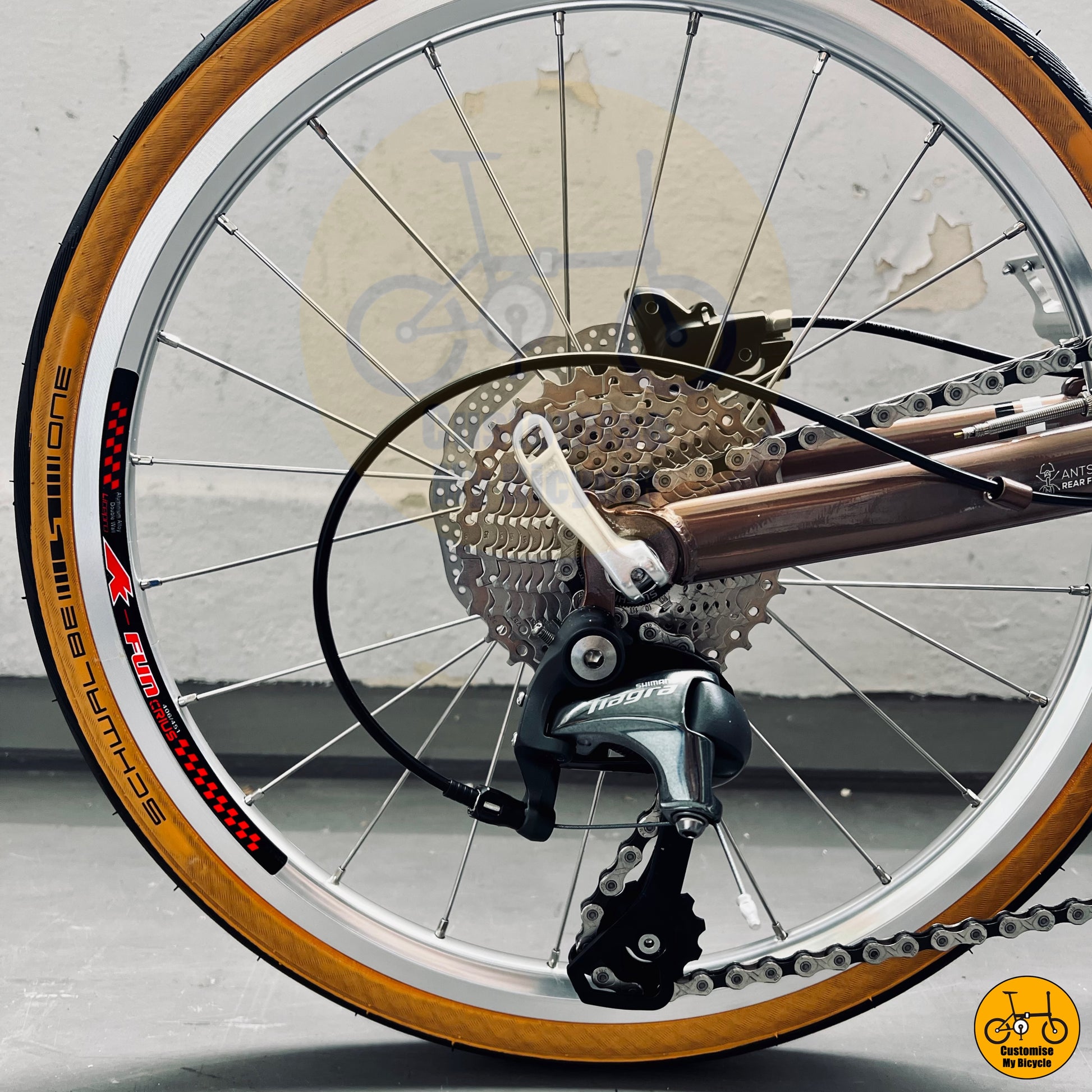 Folding bike with a refined color scheme and tan wall tyres
