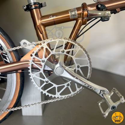 Foldable bike with a stunning rose gold frame and silver accents
