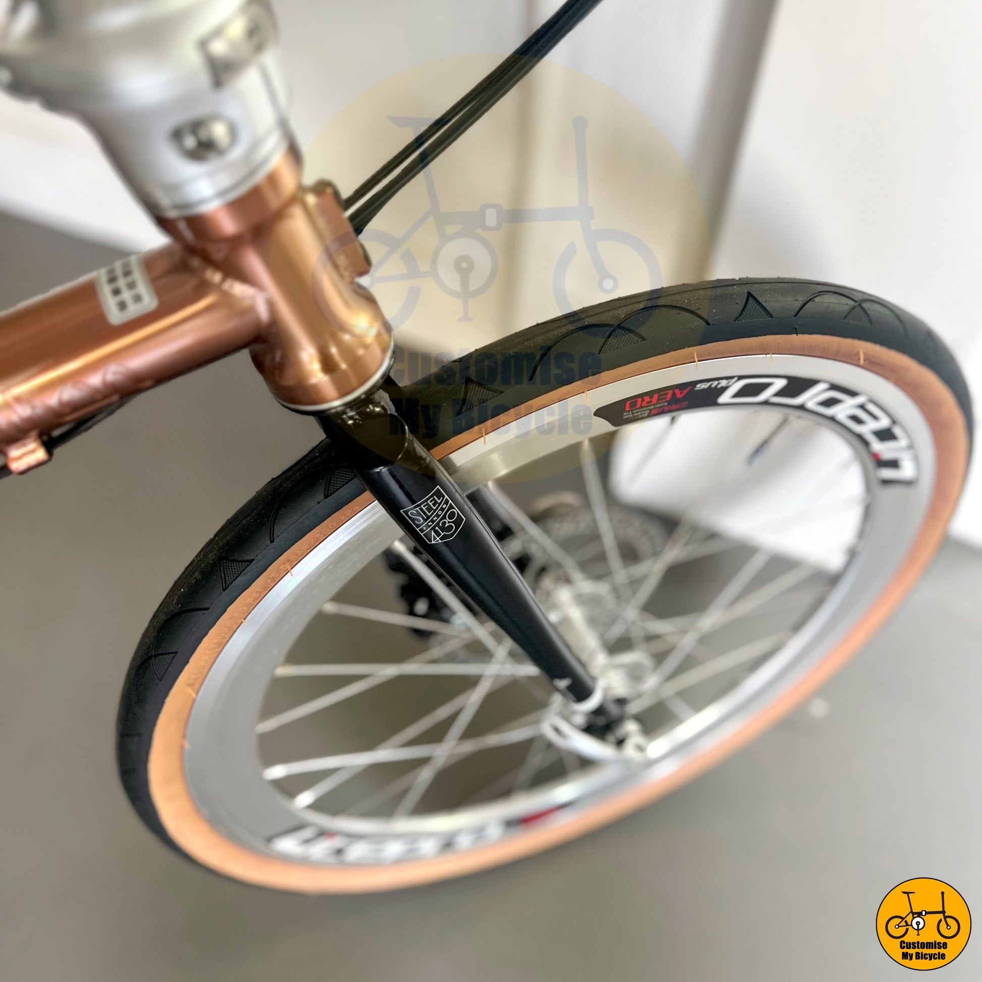 Rose gold Fnhon Gust 20-inch folding bike with brown wall Innova tyres
