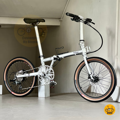 Sleek space silver foldable bike ready to ride  
