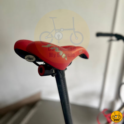 Premium folding bike with Shimano 105, carbon wheels, and top-tier red SMP saddle
