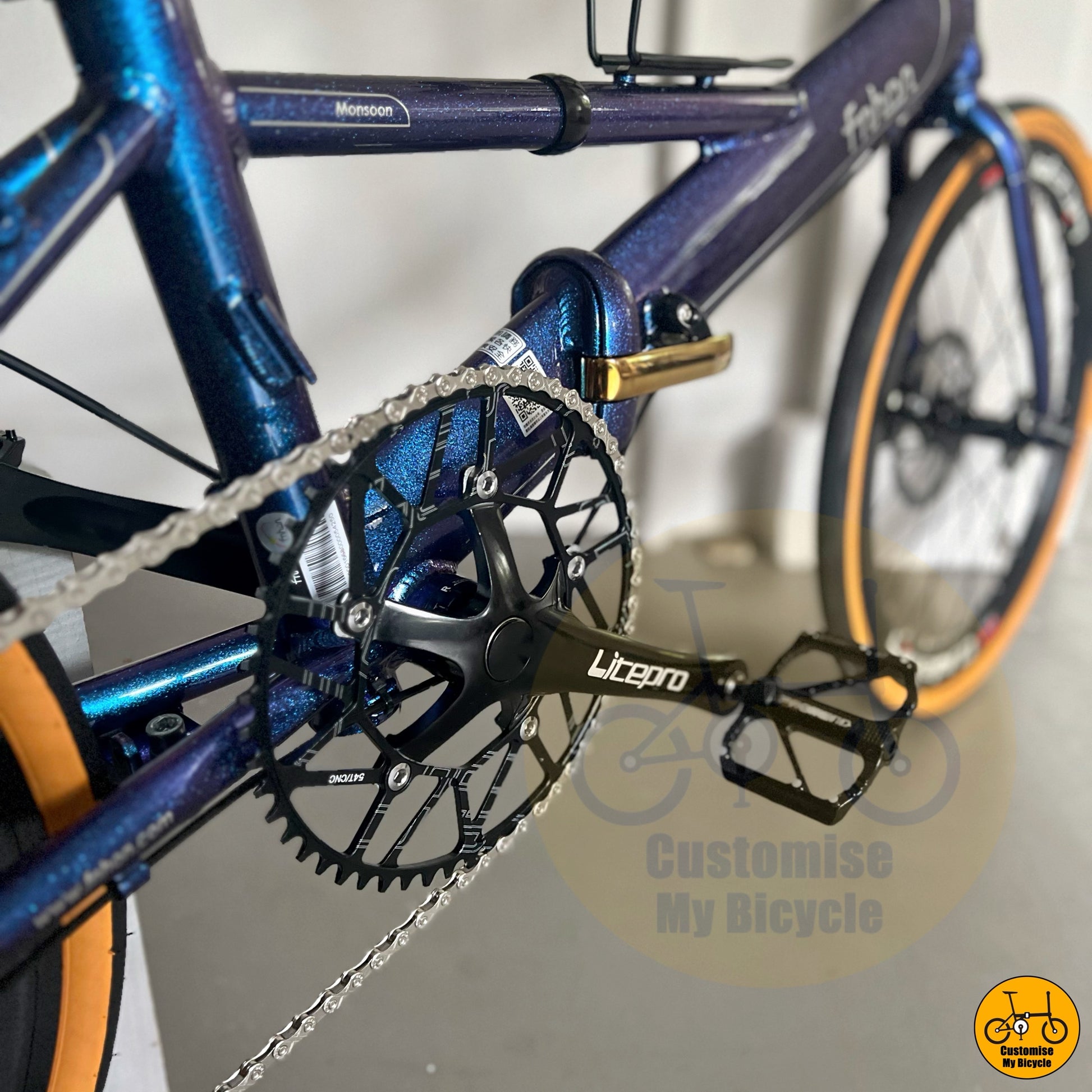 Chameleon blue city foldie with high-contrast tan tyres
