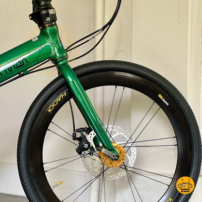 Close up of HAOOI Aero high profile front wheel on Fnhon Monsoon Emerald Green Gold folding bicycle  
