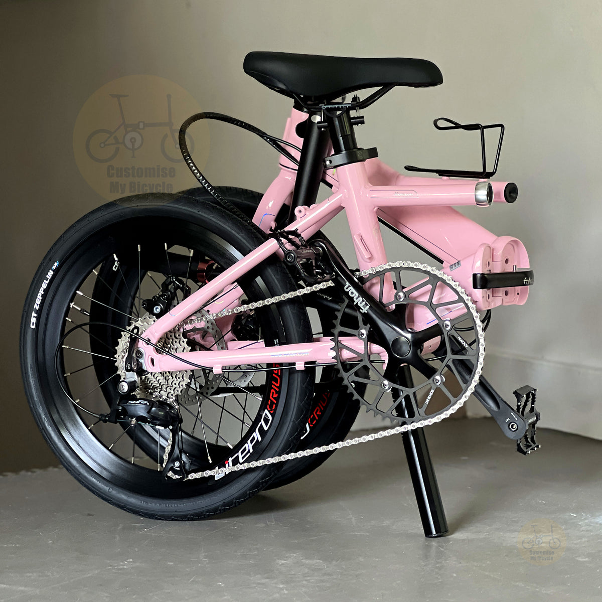 Fnhon Monsoon 20" Baby Pink folding bike in compact folded configuration