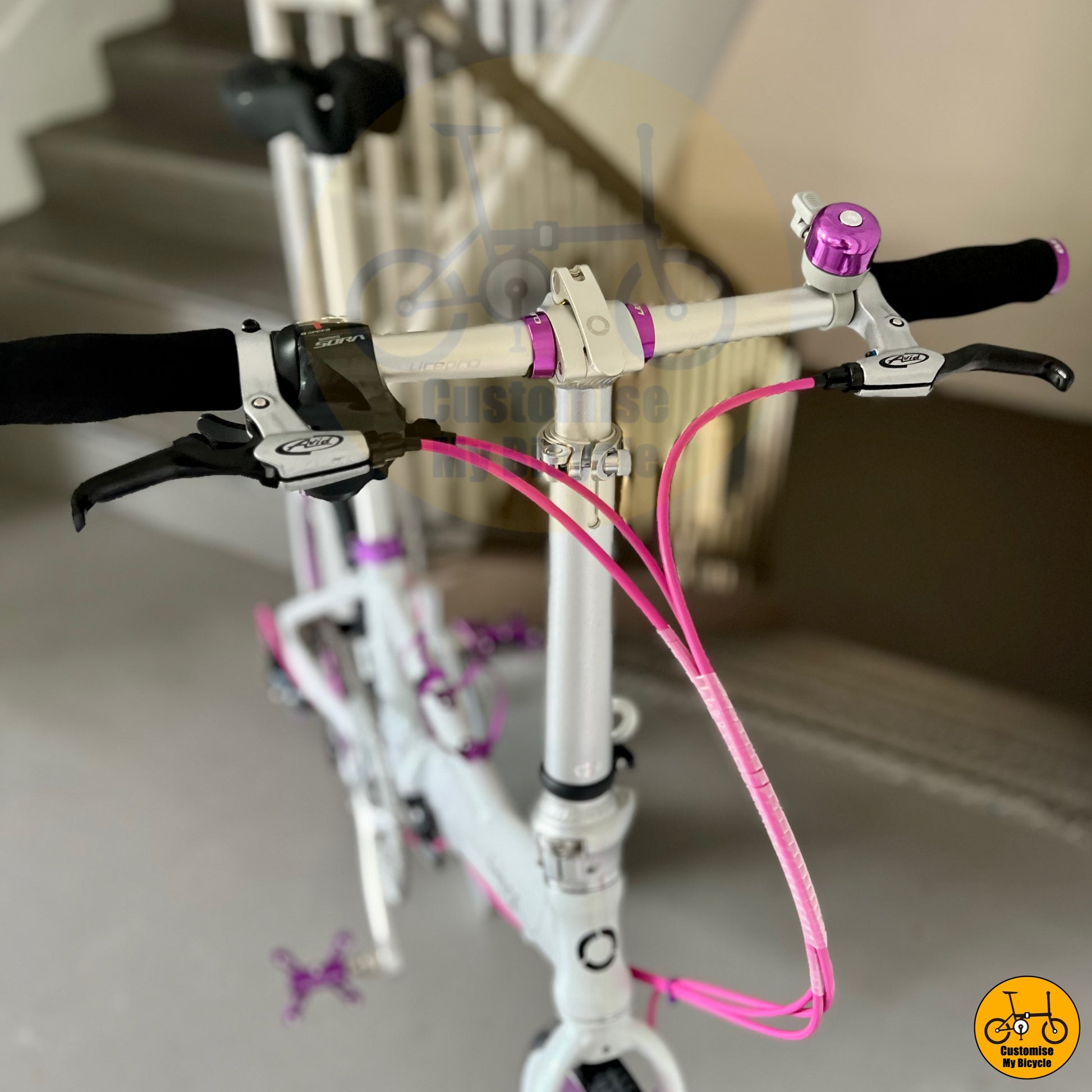 Cockpit Setup on Dreamy White & Purple Accents Fnhon Monsoon 22-Inch Folding Bike – A Stunning Design
