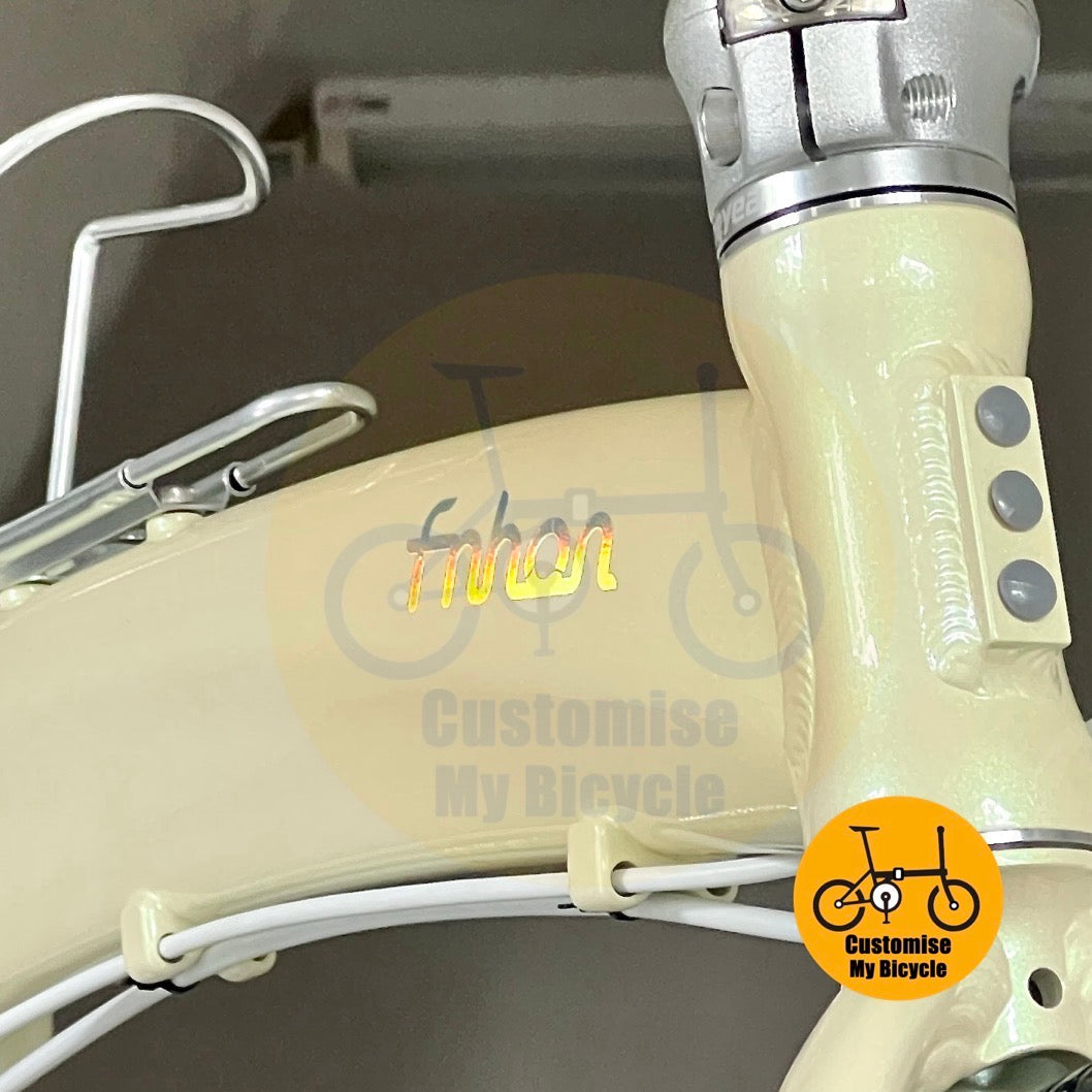 Laser rainbow logo on beige frame of Fnhon Tornado