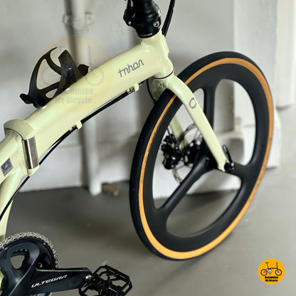 Fnhon Tornado beige folding bike angled front high view carbon wheels Shimano Ultegra setup
