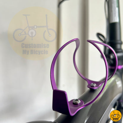 Purple bottle cage on compact foldable bike with custom purple highlights
