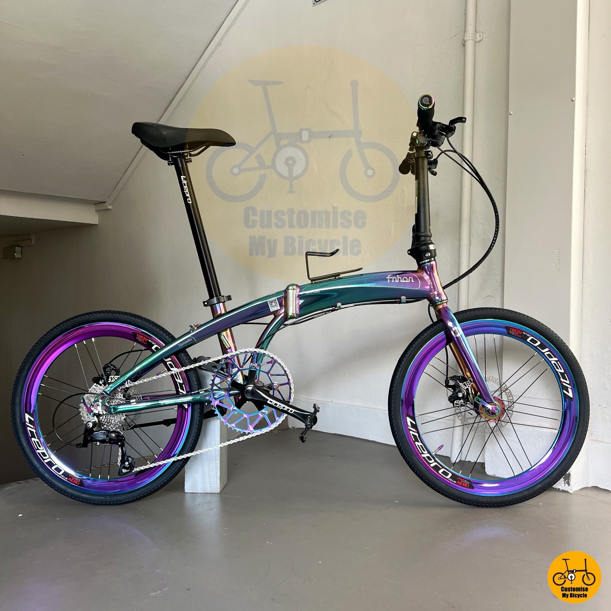 Customised rainbow-themed folding bicycle with sleek geometry
