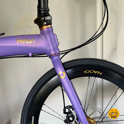 Velvet purple folding bike with gold hub  
