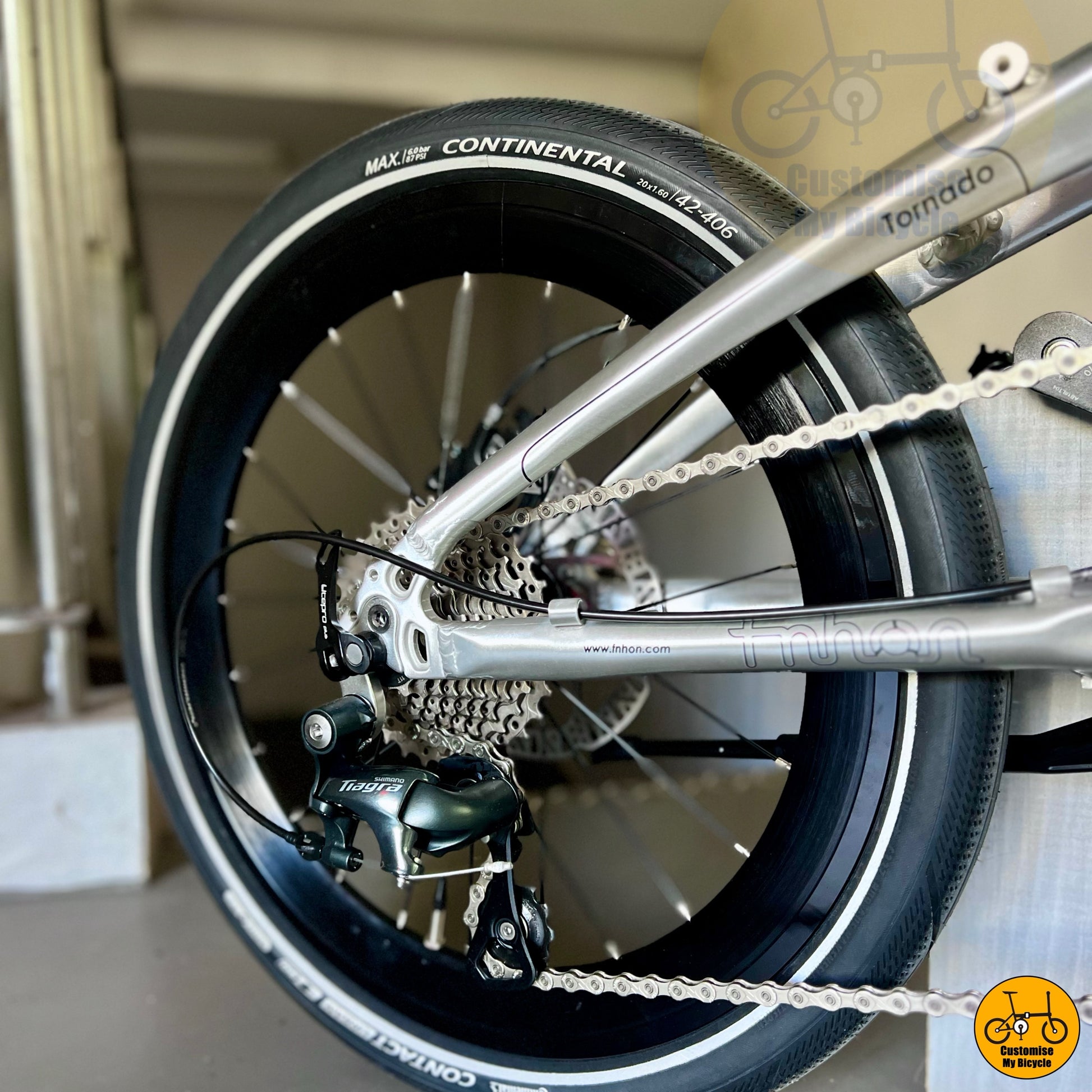 Close up of Continental Contact Urban tyres on folding bike  
