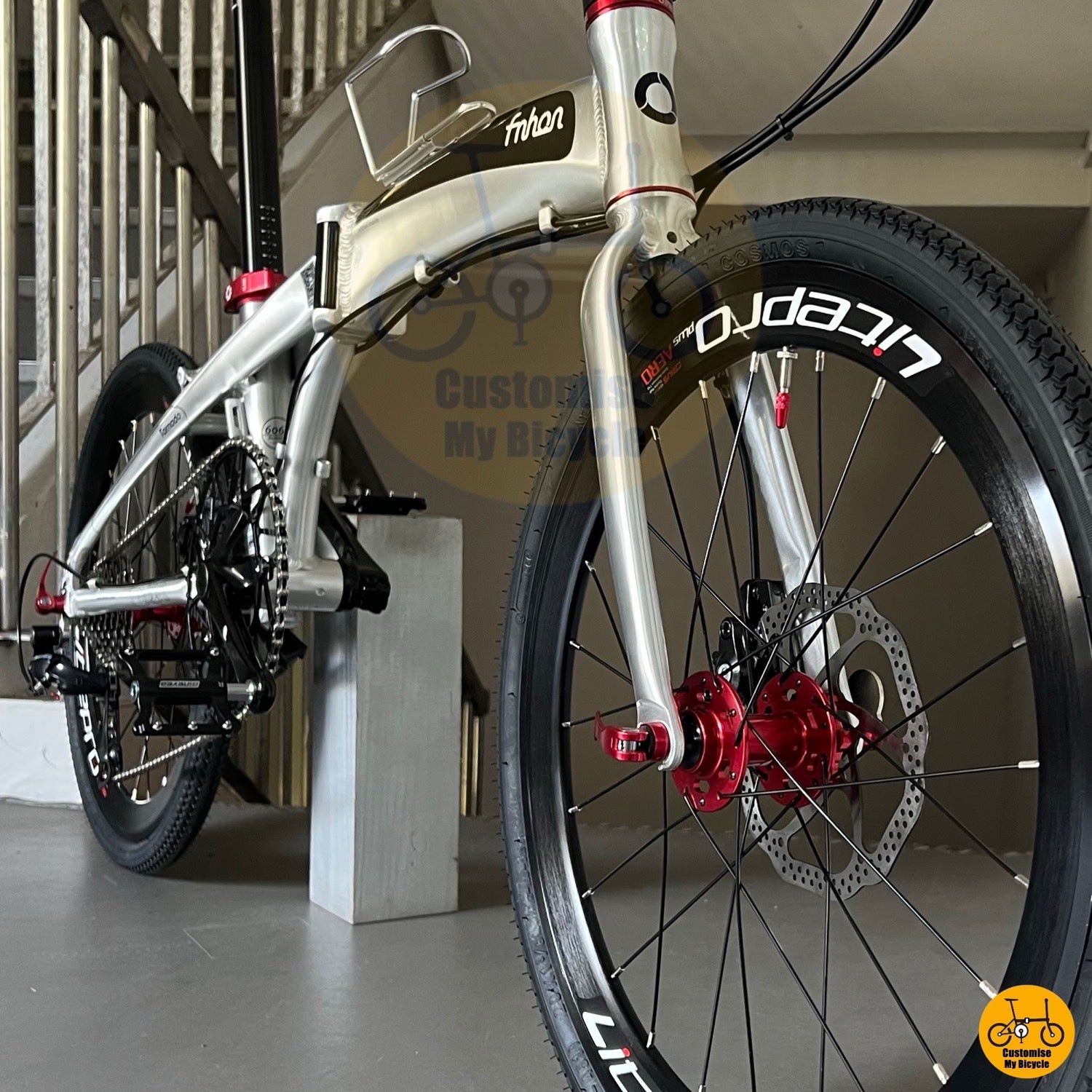 Red hub and black rim folding bicycle wheel
