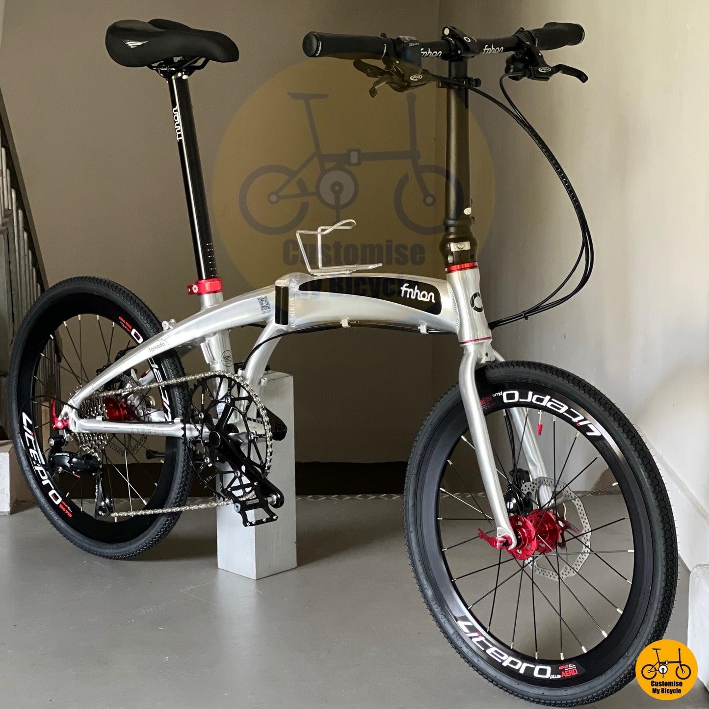 Foldable bicycle with black and red accent components
